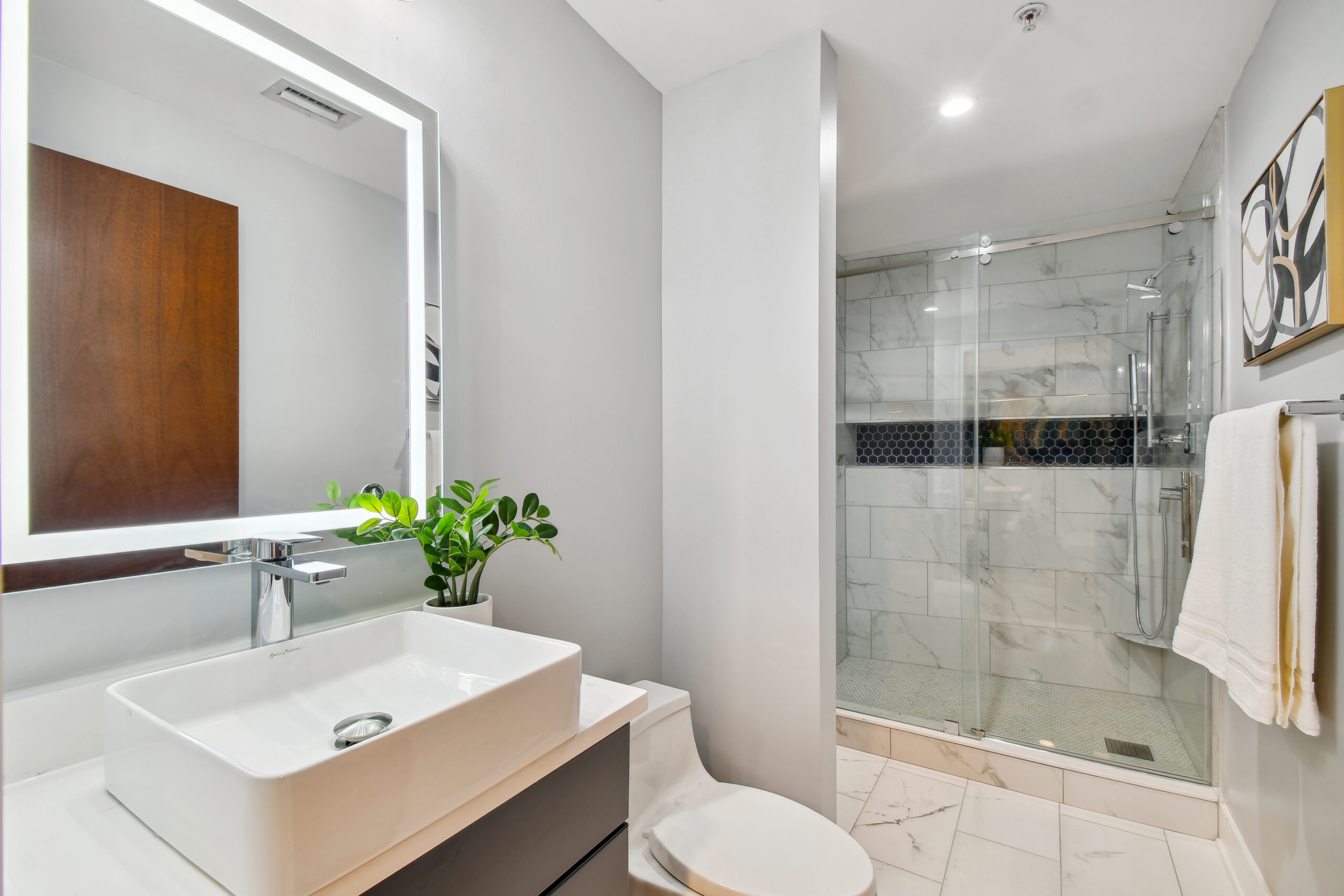 Full remodeled bathroom inside luxury condo in Tampa's Channel District